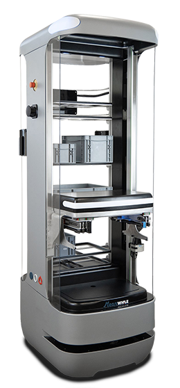Enclosed industrial 3D printer with a vertical build chamber and the door open, showing the build platform inside.