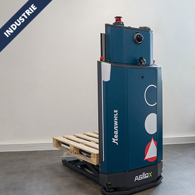 Autonomous blue industrial pallet robot lifting a wooden pallet, with a red beacon on top, in a clean warehouse.
