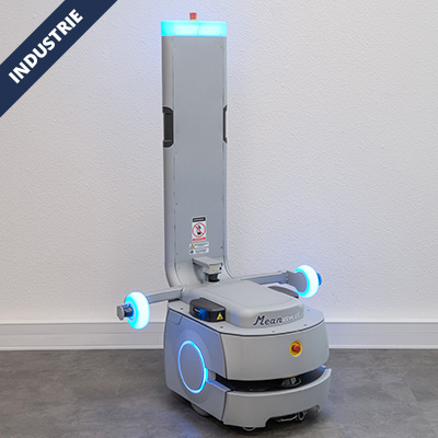 Autonomous industrial robot with blue LED lights and a tall vertical column in a gray base, standing against a wall in a facility setting.