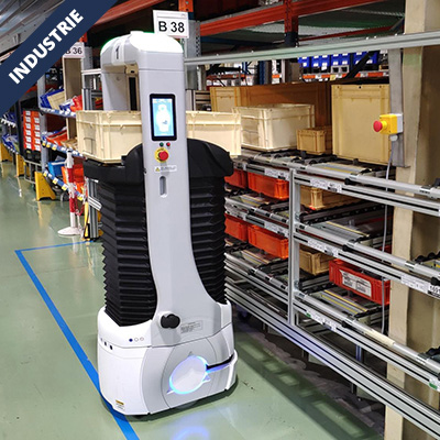 Autonomous warehouse robot navigating an aisle between shelving with plastic bins labeled B38 and other numbers.