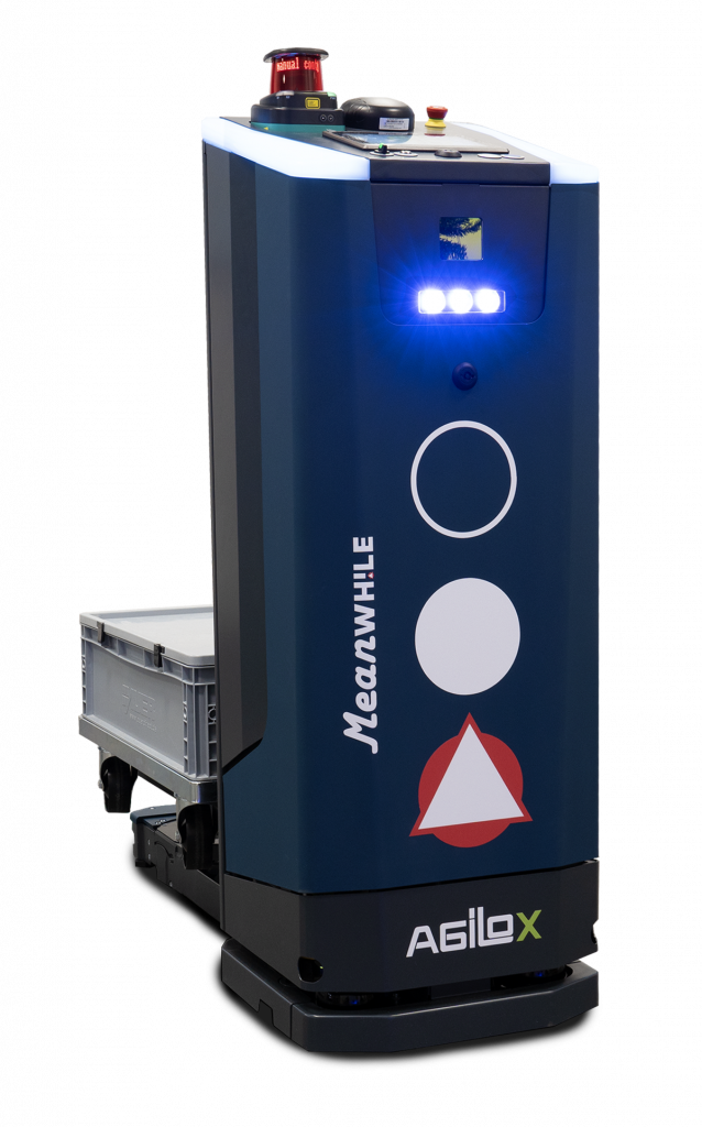 Blue Agilox autonomous mobile robot with LED warning lights, safety symbols, and control panel on top, standing with a crate tray nearby
