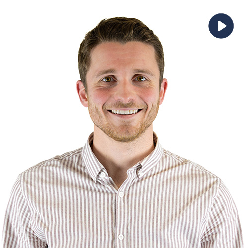 Video thumbnail: smiling man in a light striped shirt on a white background, play button in the top-right corner.