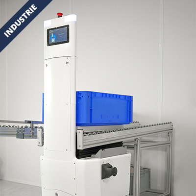 White automated conveyor station with touchscreen control placing a blue bin on the belt.