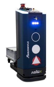 Blue Agilox autonomous mobile robot with LED warning lights, safety symbols, and control panel on top, standing with a crate tray nearby